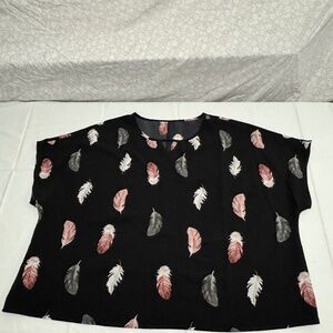 woman black blouse with leaves pattern